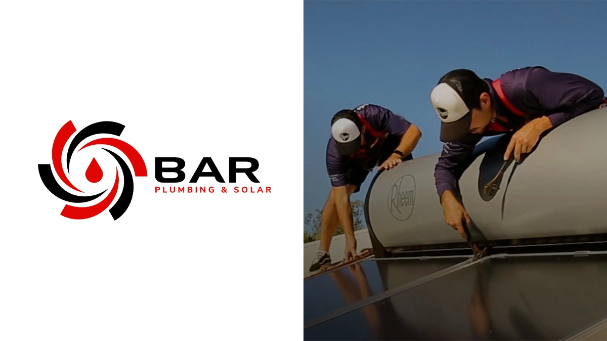 Bar Plumbing logo on left, with two men working on solar panels on right